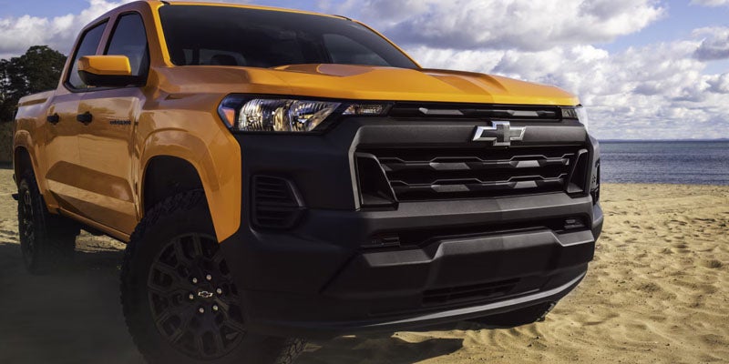 2026 Chevrolet Colorado front grille in St. Clairsville, OH, showcasing a bold and rugged design, featuring distinctive Chevy branding for enhanced truck styling.