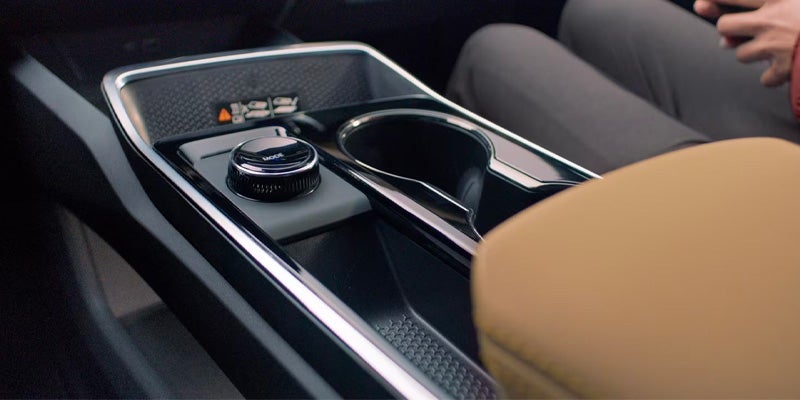 2026 Chevrolet Equinox center console with Drive Mode Selector knob in St. Clairsville, OH, allowing drivers to easily switch between different driving modes for optimal performance, including Normal, AWD, Snow, and Off-Road.